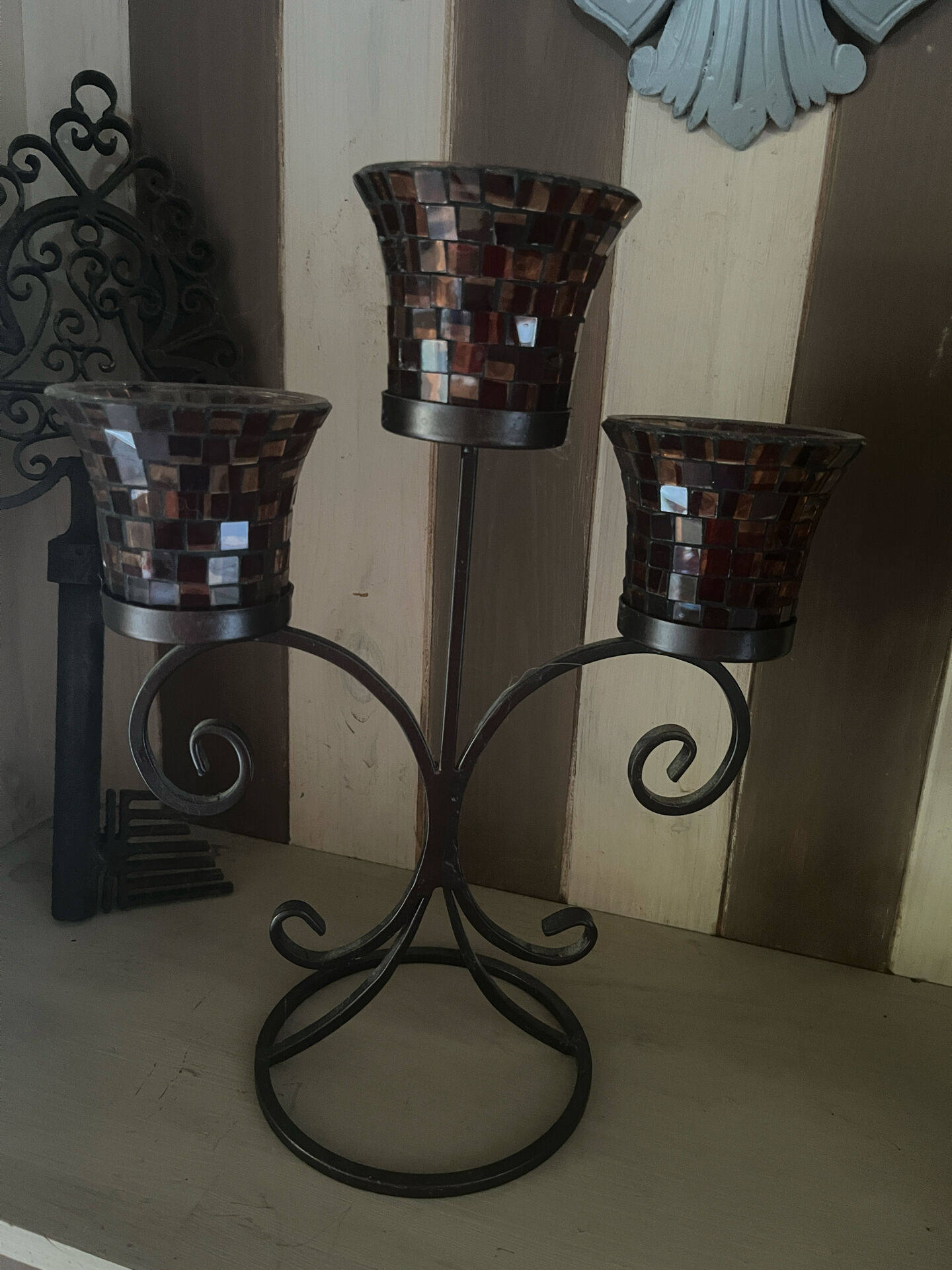 Three-branch candlestick in wrought iron and glass mosaic.