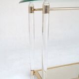 Hollywood Regency console table in lucite, glass and gold metal. 1980s