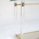 Hollywood Regency console table in lucite, glass and gold metal. 1980s