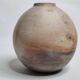 Round ceramic vase with raw finish, smoked firing, signed, late 20th century, 11 cm.