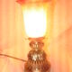 bronze bedside lamp with a pink cracked glass shade