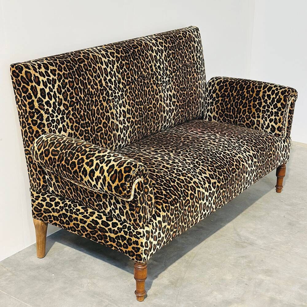Vintage leopard velvet sofa / wall sofa with drop-down arms, France.