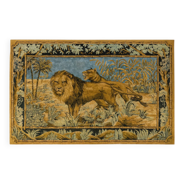 Antique wall tapestry in velvet depicting a scene with a lion and lioness.