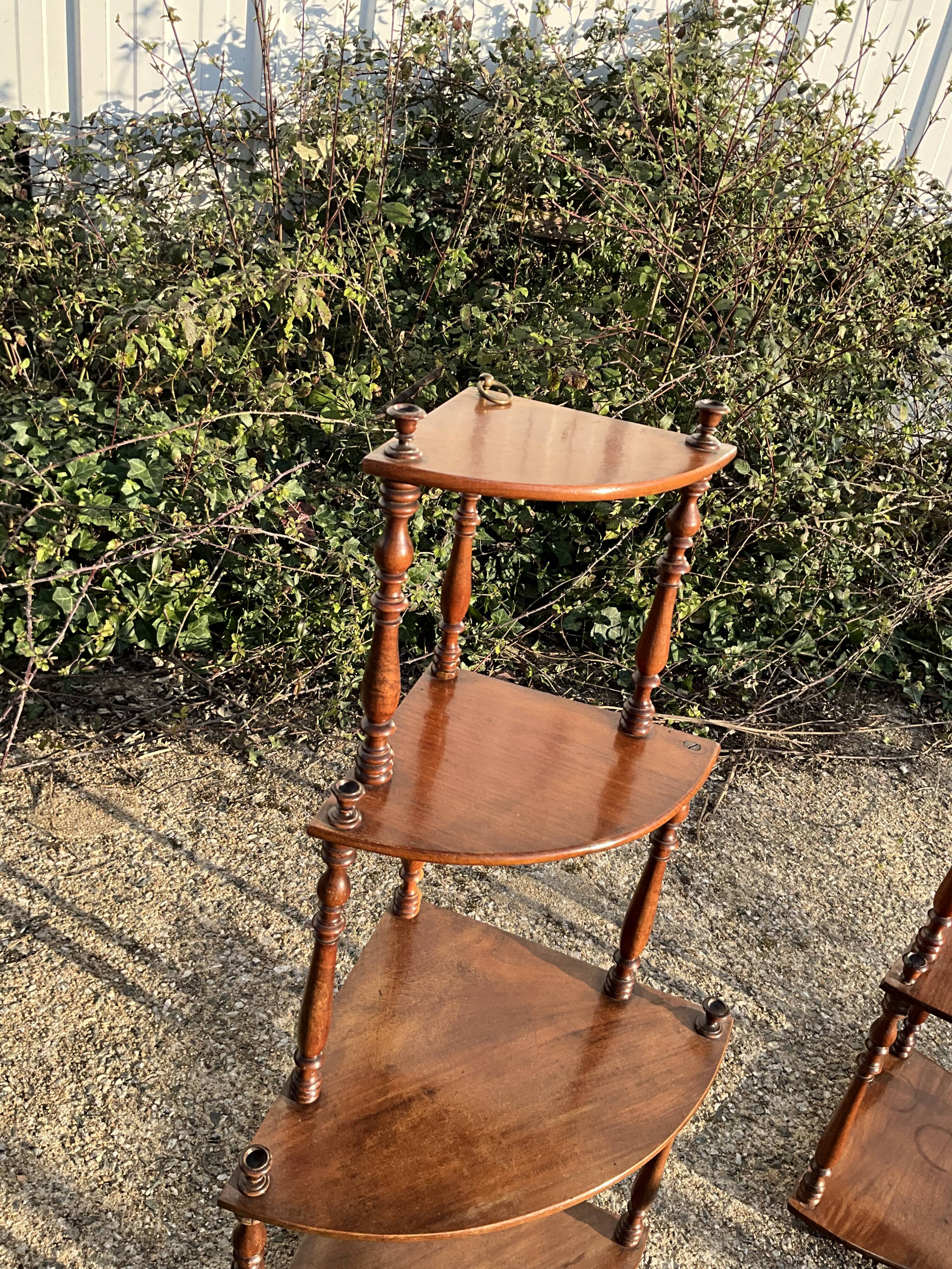 pair of corner wall brackets, Louis-Philippe style, in mahogany.