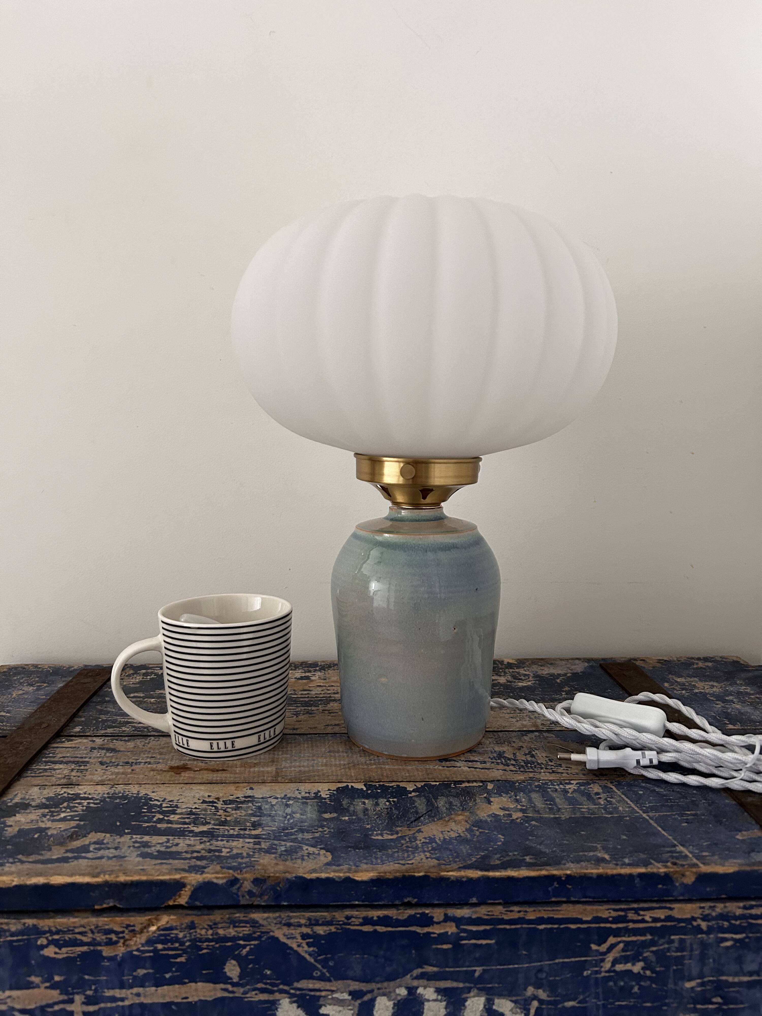 Table lamp in pastel blue and pleated opaline ceramic
