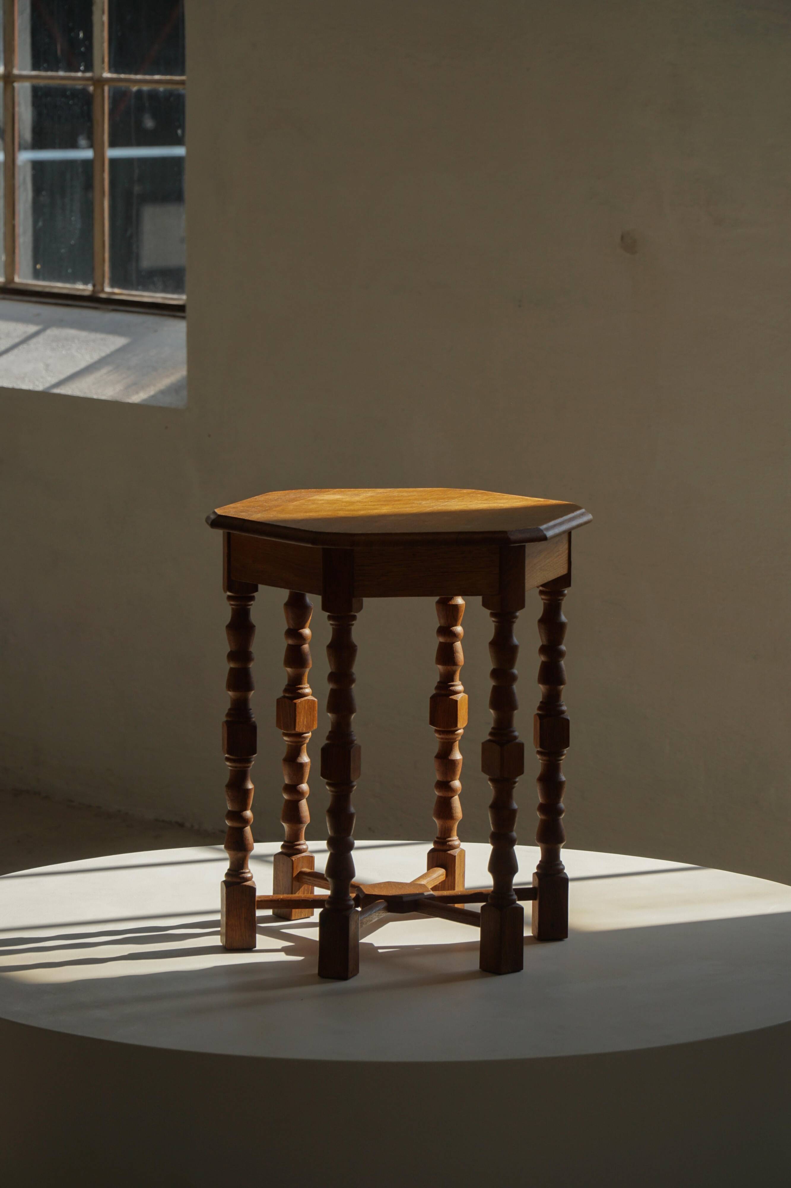 Danish hexagonal side table in oak with turned legs, 1950s.