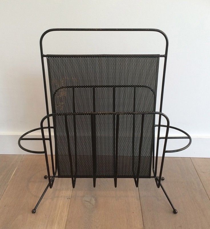 Black lacquered metal and perforated metal magazine rack designed by Mathieu Matégot 50.