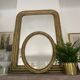 Miroir en bois doré patiné 58cm