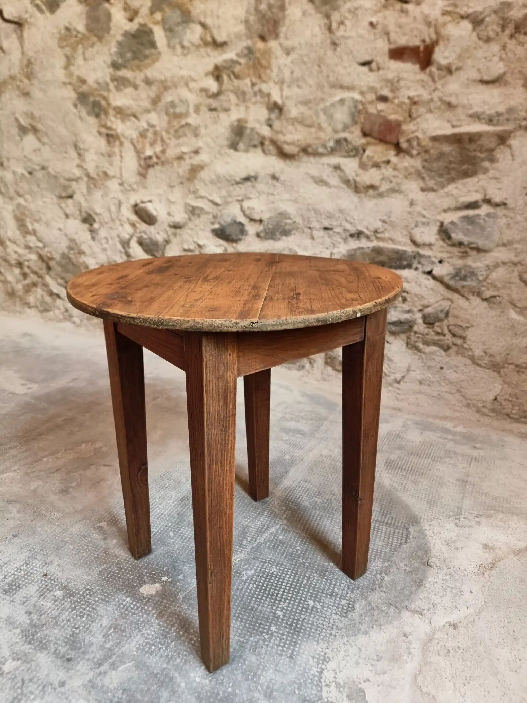 Antique round side table with oak legs and a pine top, circa 1900.
