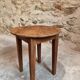 Antique round side table with oak legs and a pine top, circa 1900.
