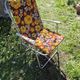 Vintage folding camping chair in canvas with brown and yellow flower print 70s