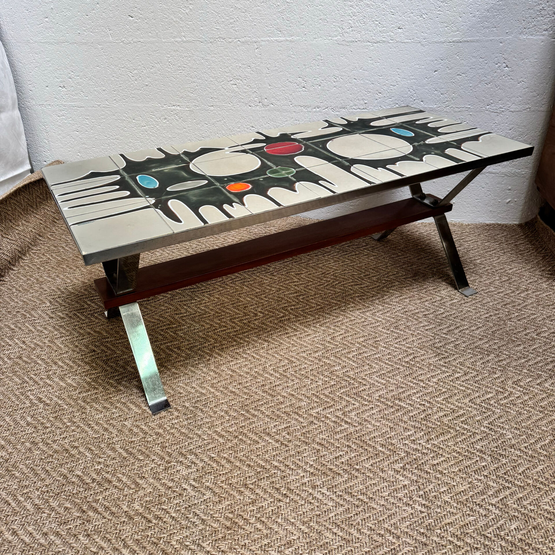 Vintage coffee table from the 60s and 70s in ceramic, chrome metal, and wood.
