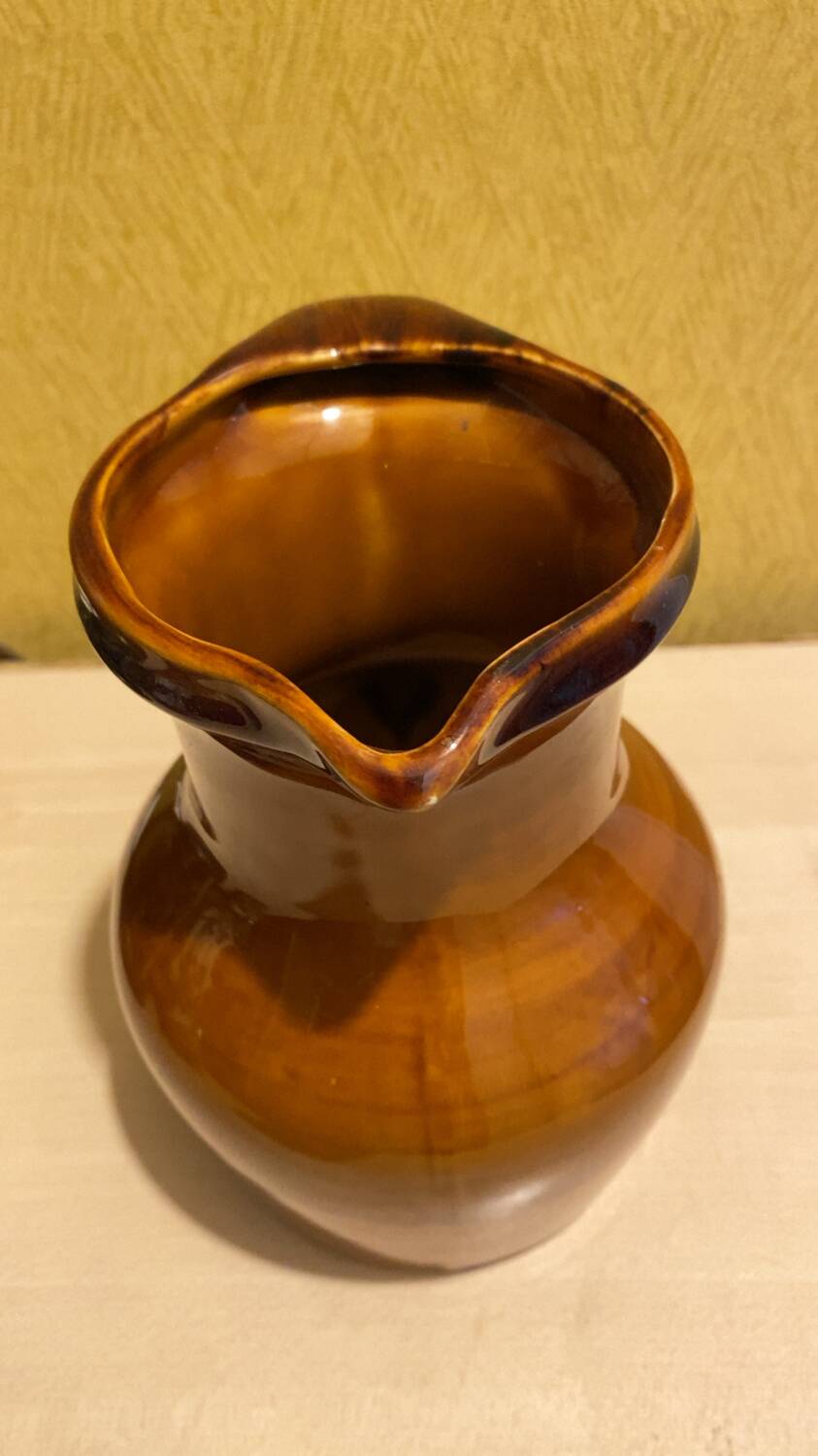 St. Clement brown ceramic pitcher, 1970