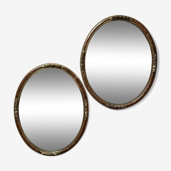 Paire de miroirs ovales avec encadrement en bois stuc et laque 55x44cm