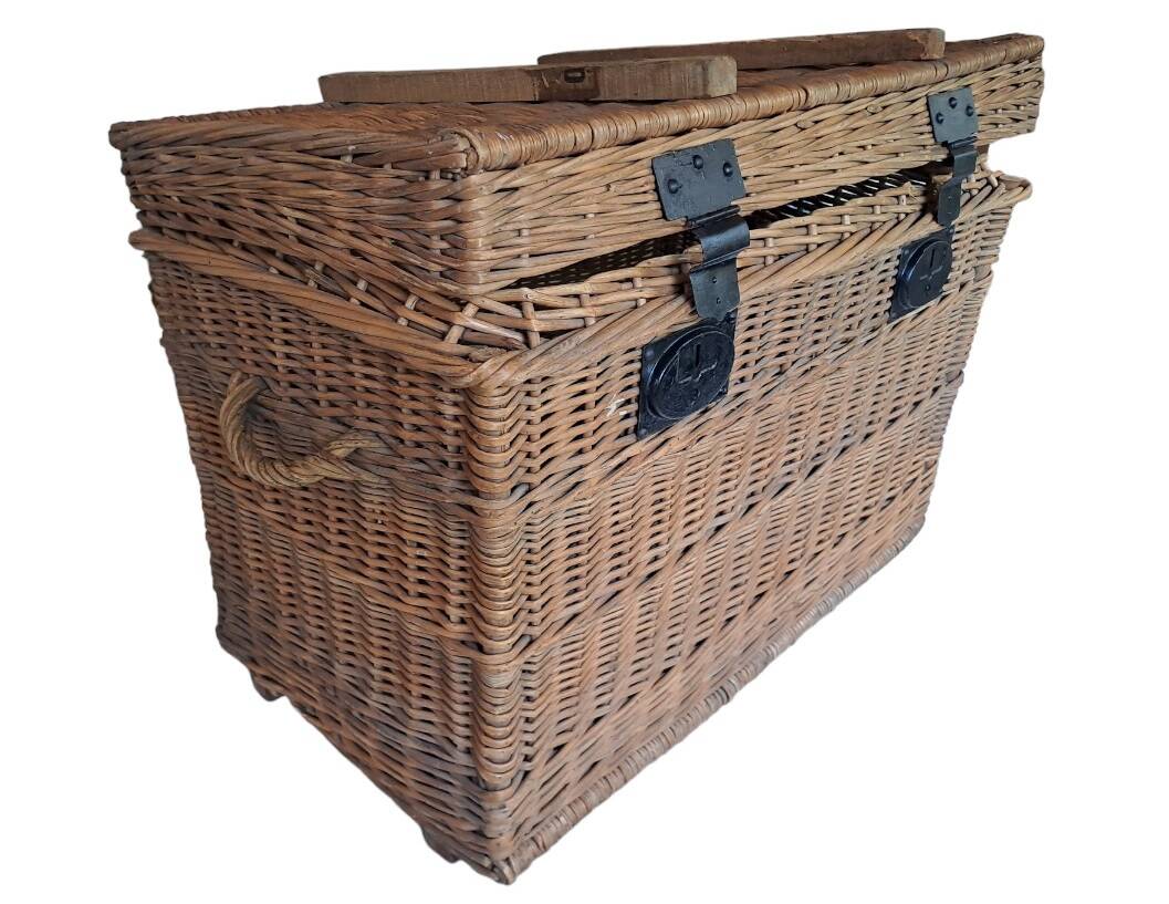Wicker travel trunk XIX with metal clasps and handles.