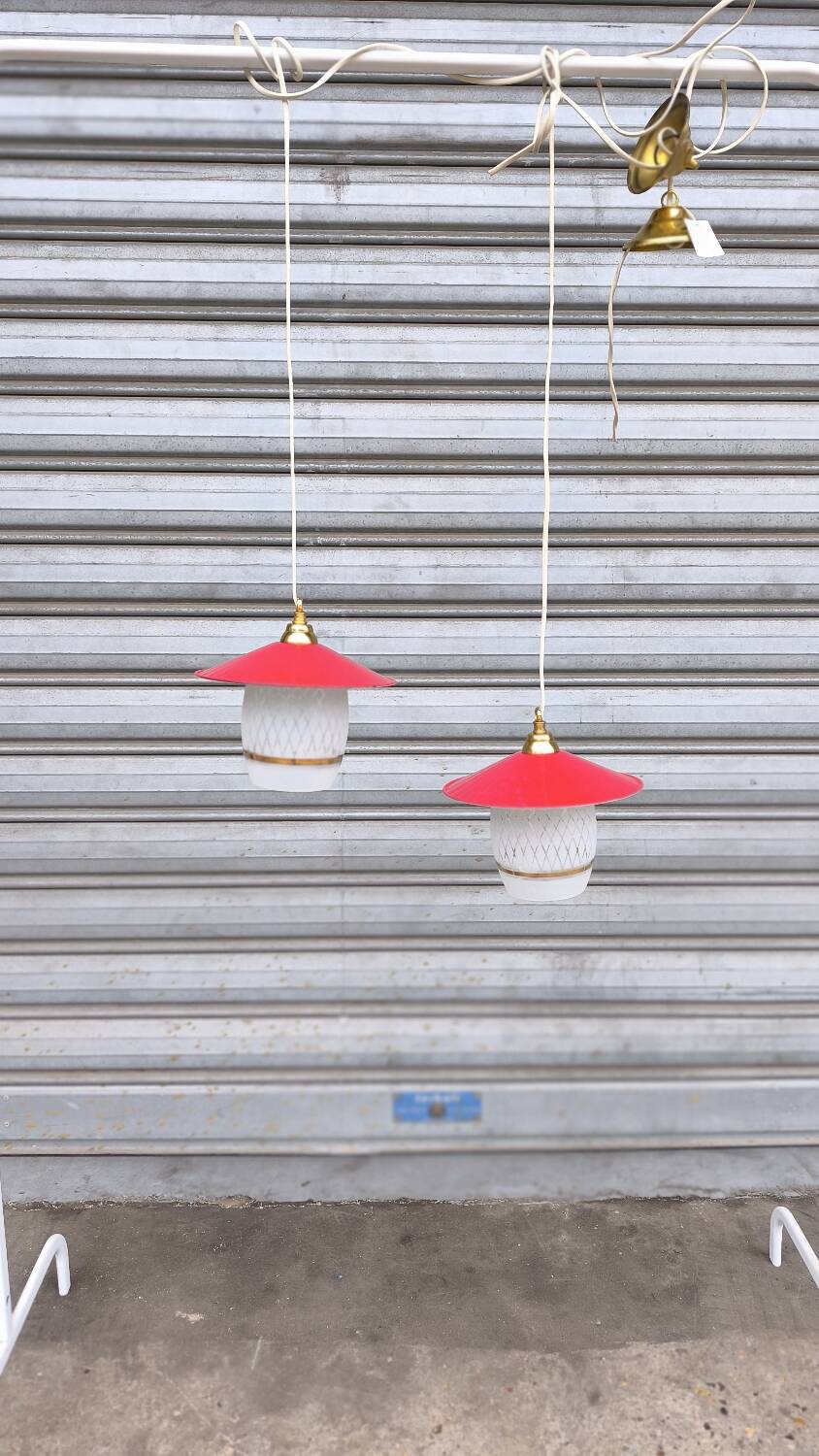 Pair of enamelled sheet metal and glass pendant lights