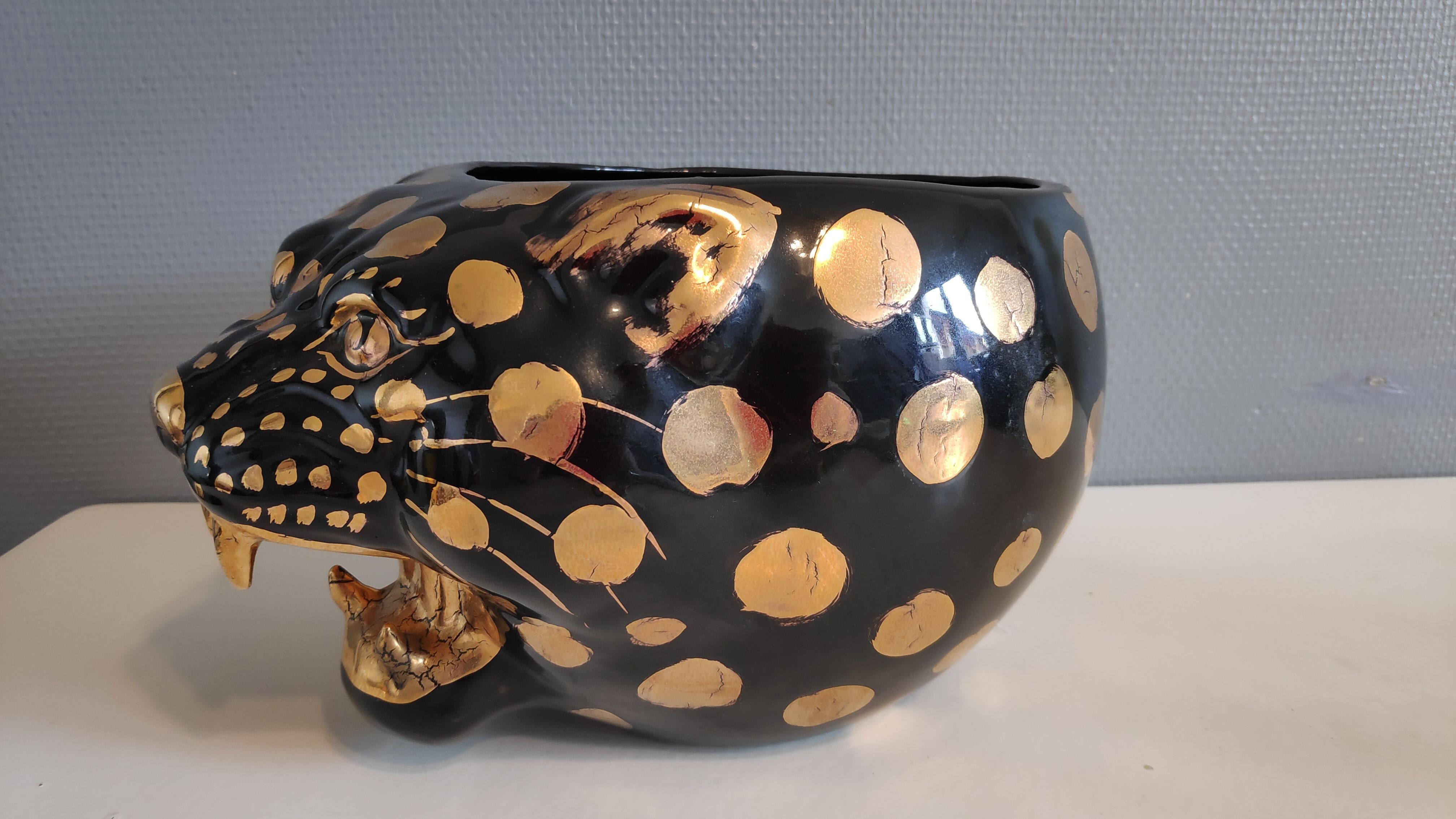 black and gold ceramic panther pot cache
