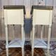 Pair of Louis XVI style bedside tables painted white.