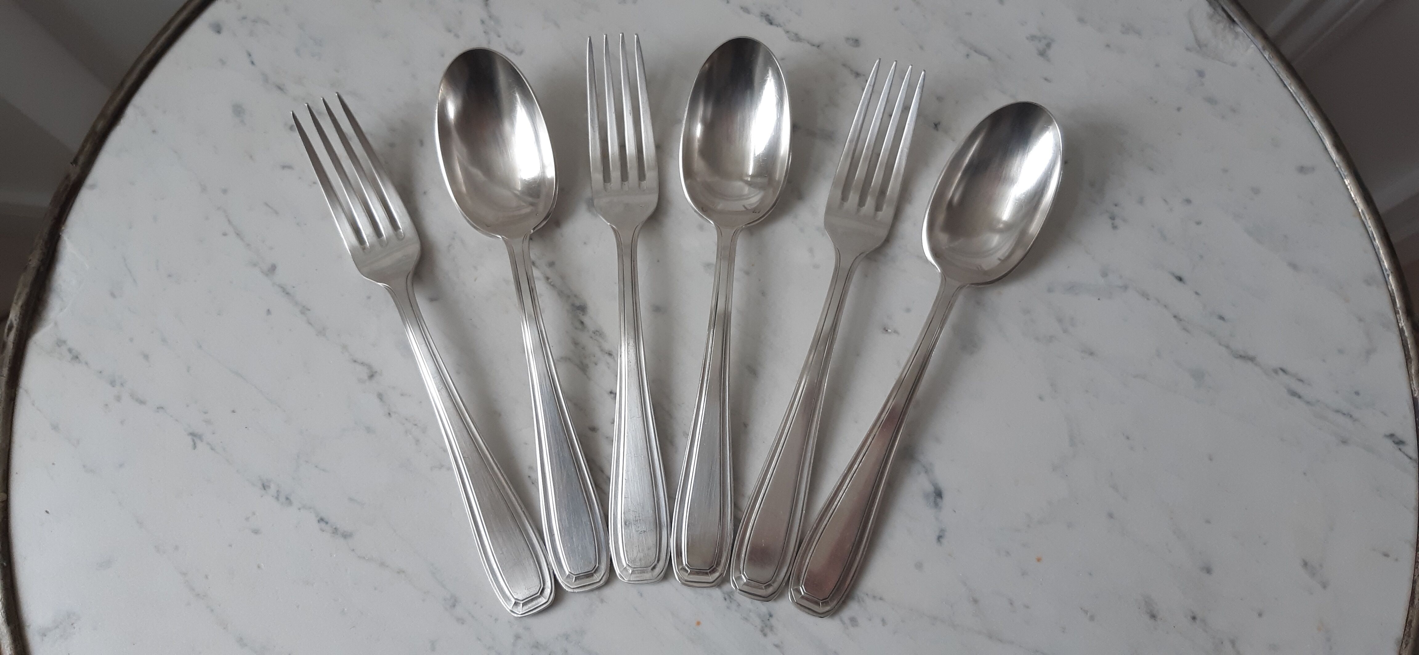 Set of silver metal cutlery 20s
