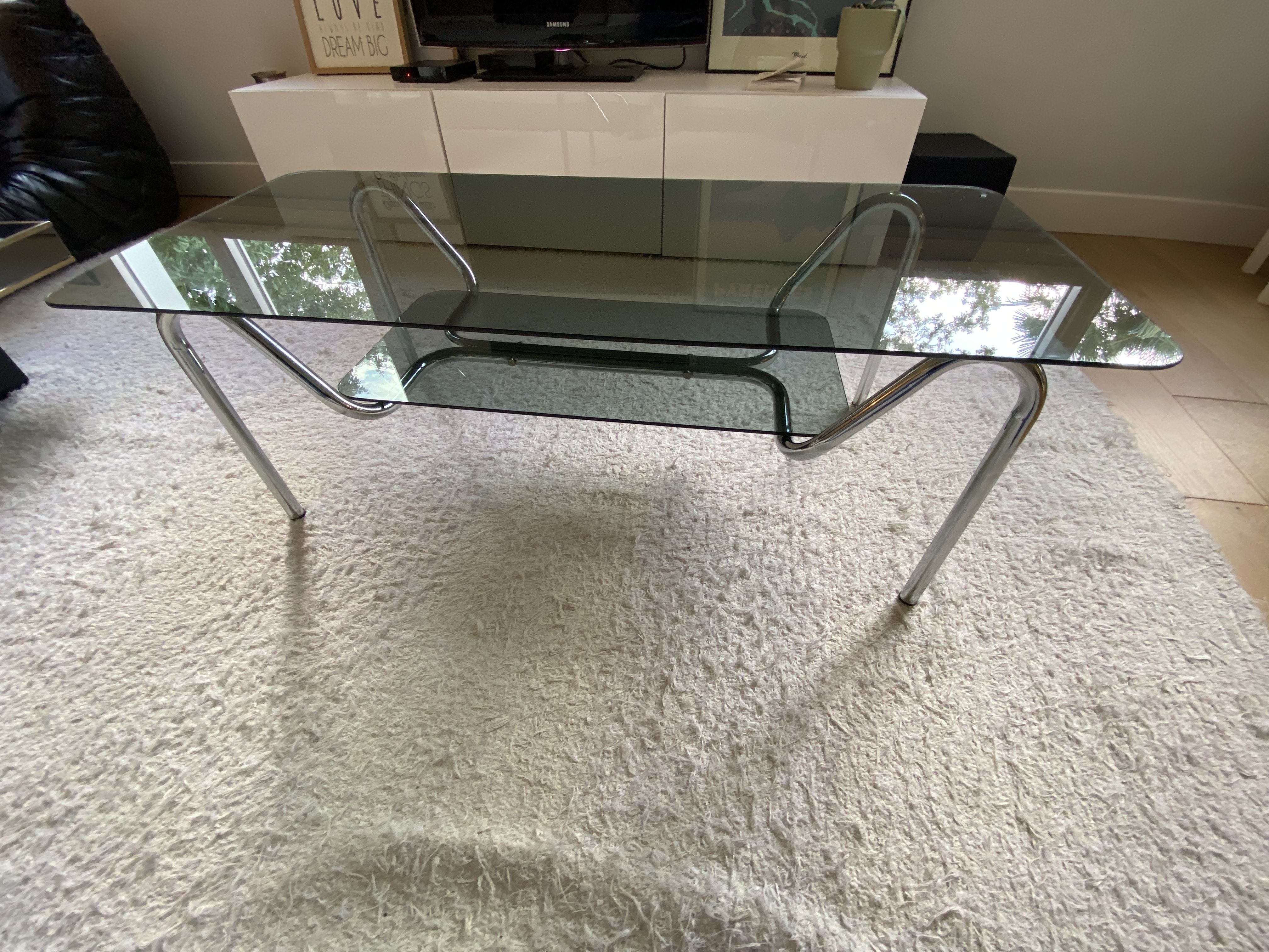 Double top coffee table in smoked glass and tubular structure in chromed steel