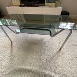 Double top coffee table in smoked glass and tubular structure in chromed steel