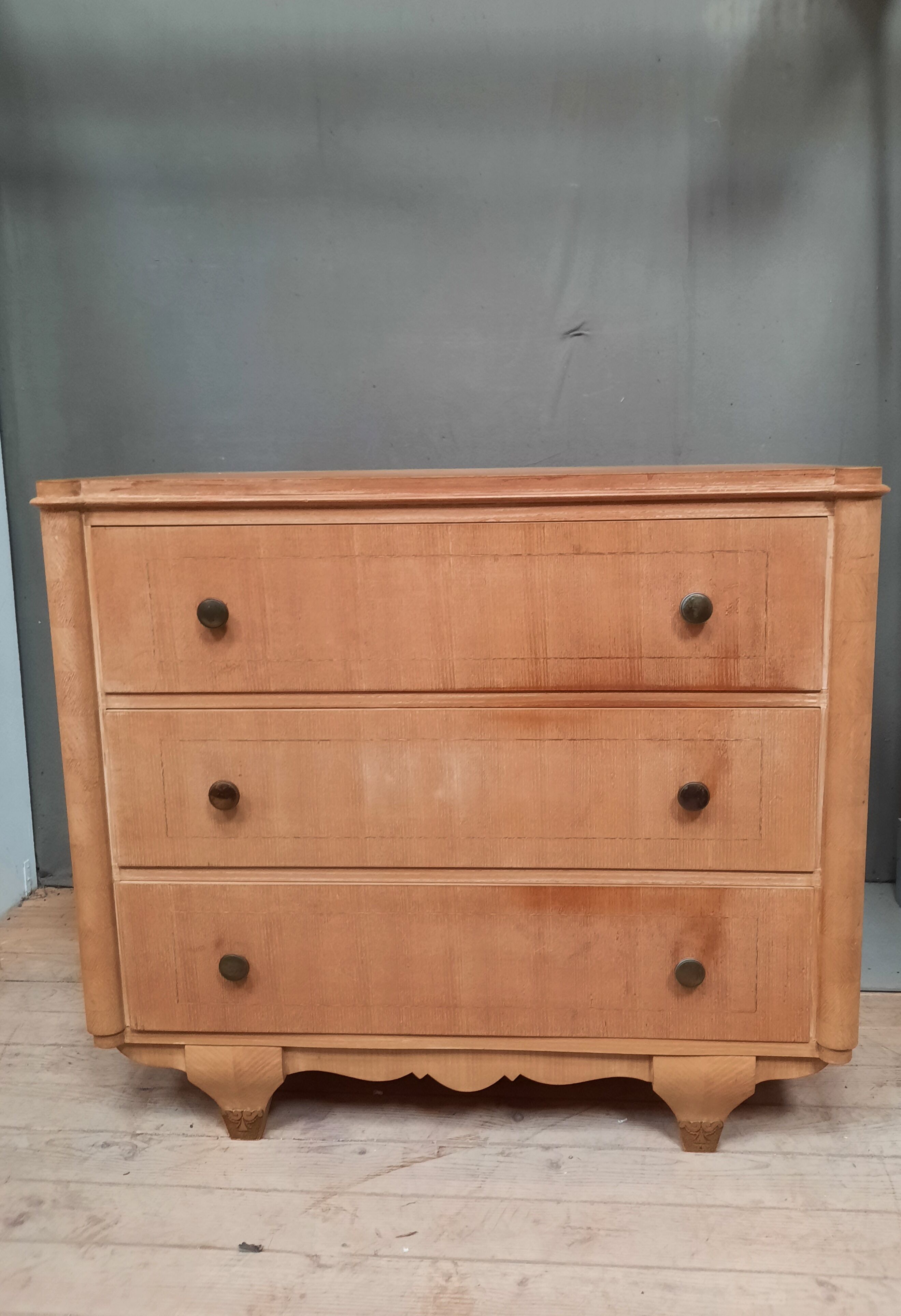 Vintage wooden chest of drawers with clear veneer