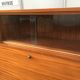 Vintage secretary with wooden compass feet with felling, shop window and closet