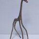 five vintage brass sculptures of gazelles, antelopes, and a giraffe