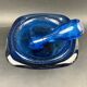 Mortar and pestle in the style of Biot, hard blue.