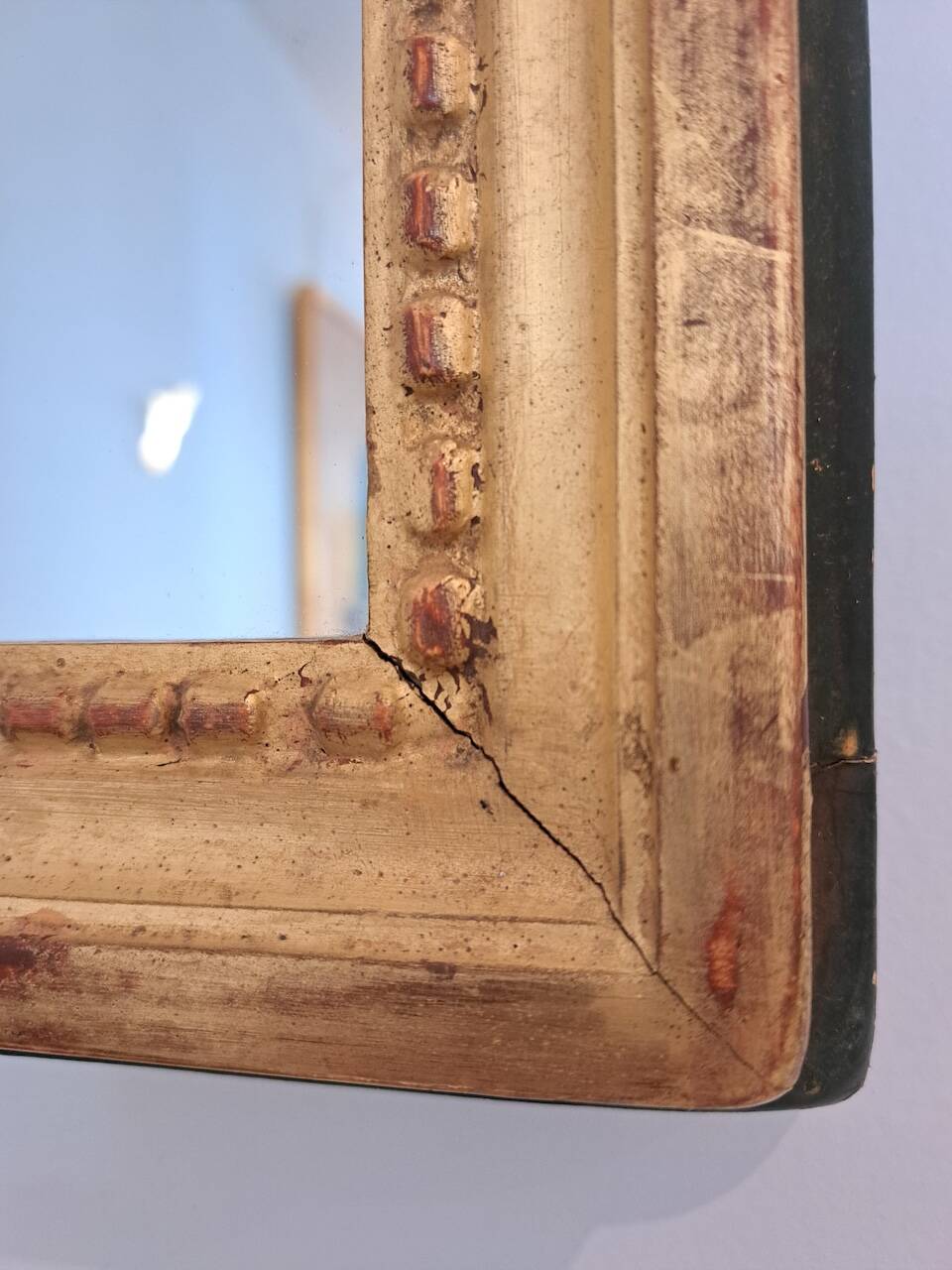 Antique mirror in wood and gilded stucco