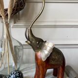 Wooden elephant and brass