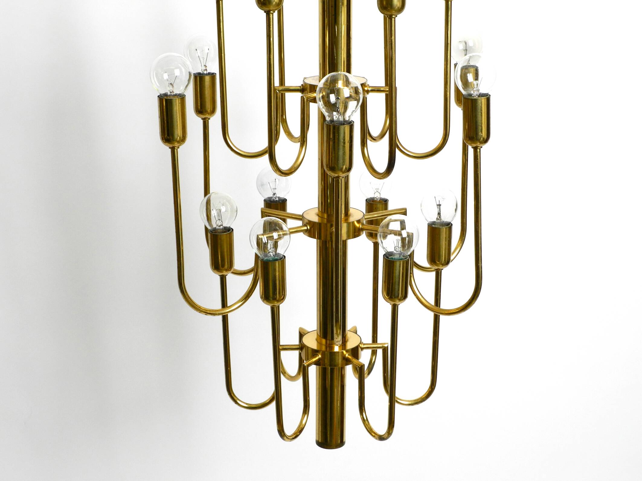 Three staged 18 arm Mid Century brass chandelier with a long brass rod