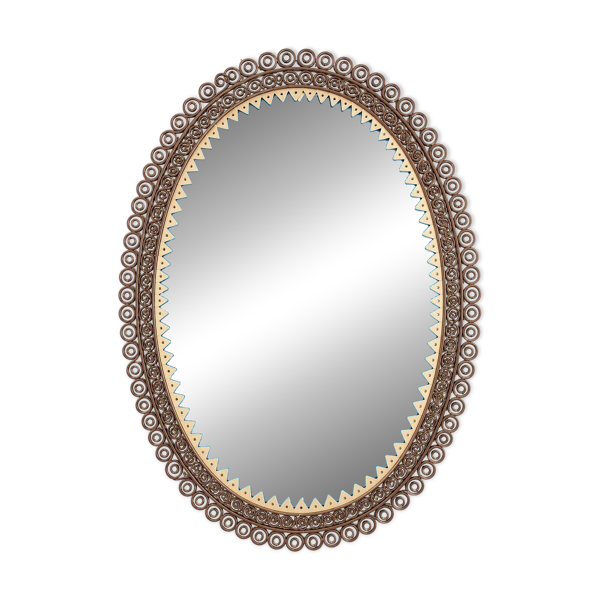 Miroir cisele entouré de metal