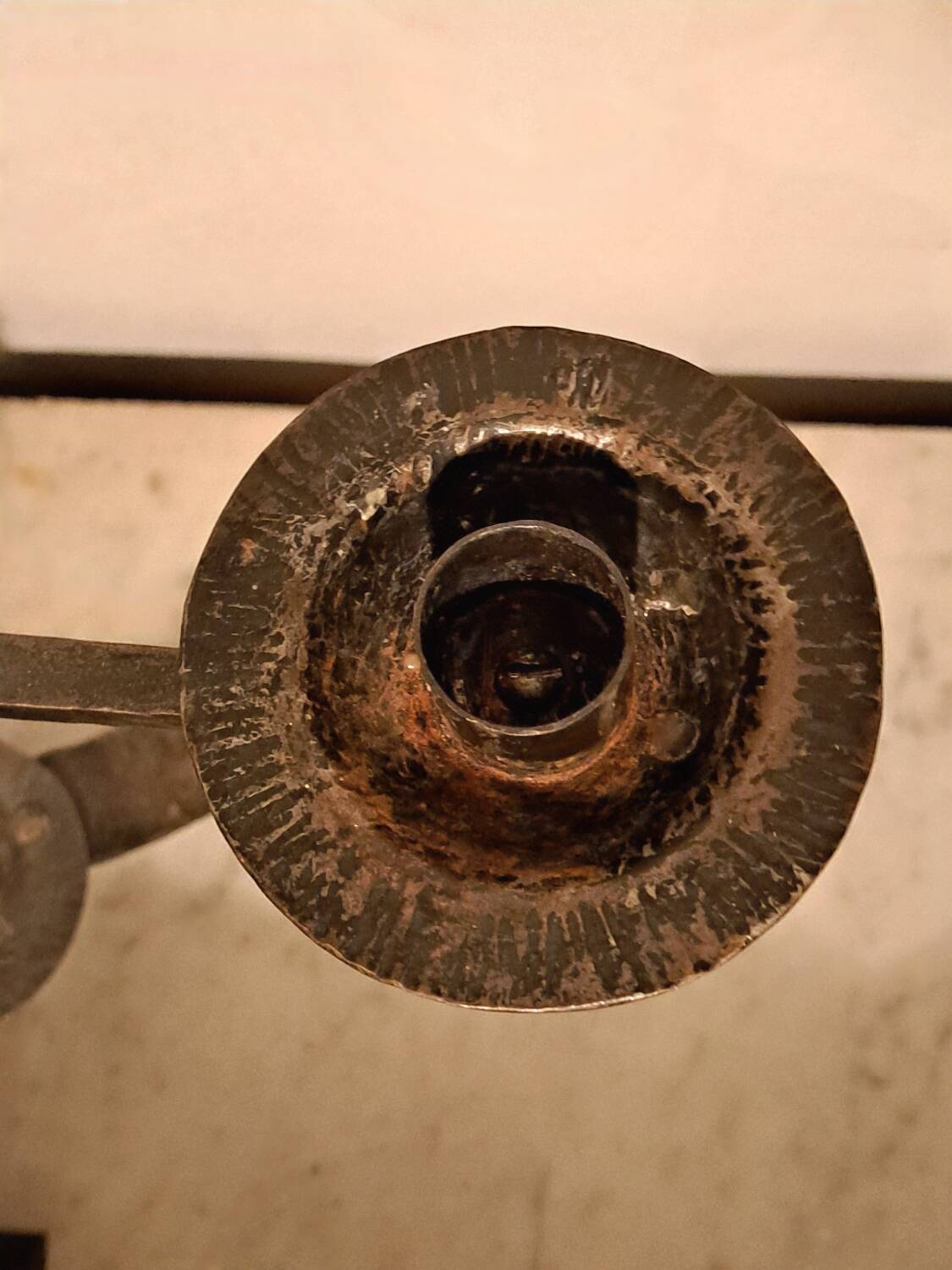 Black wrought iron fleur-de-lis candlestick