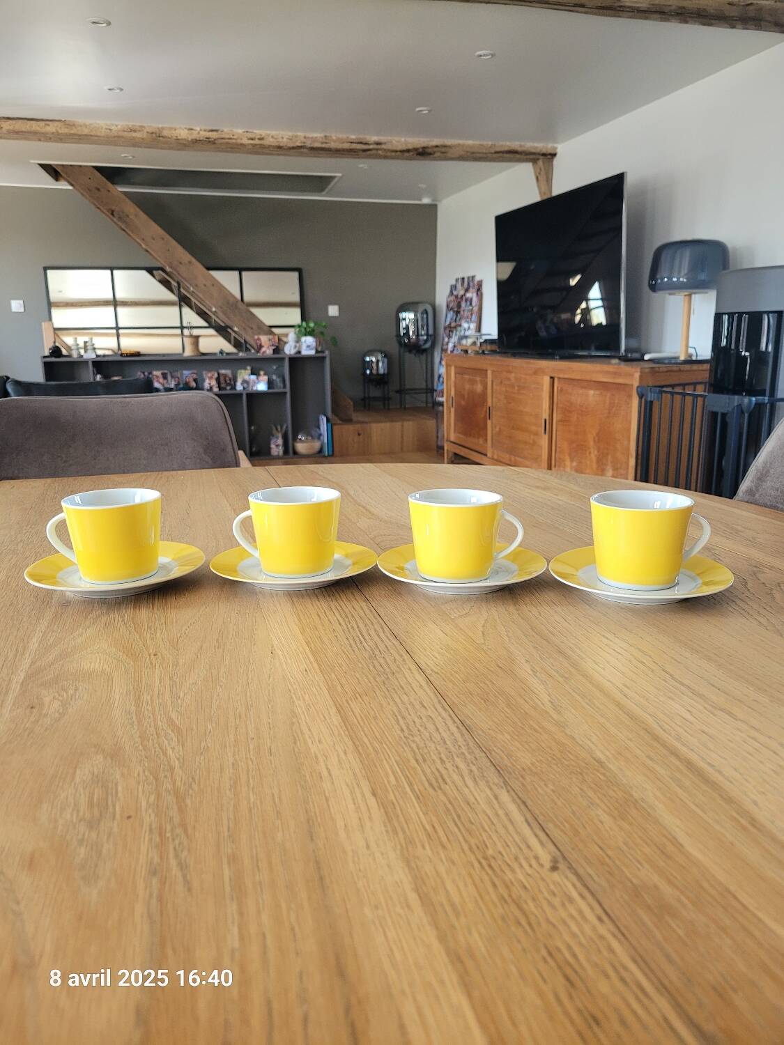 4 yellow and white cups and saucers