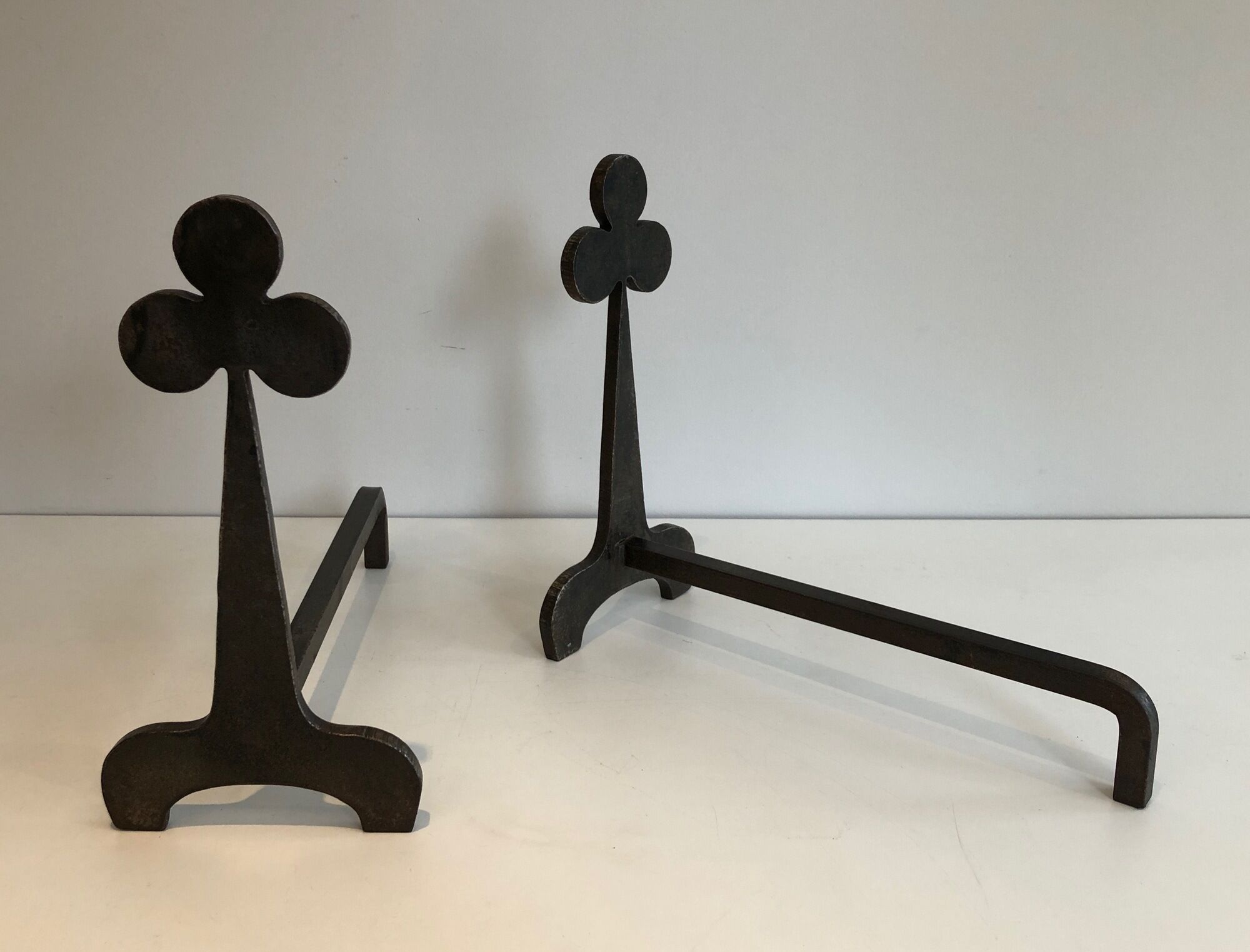 Pair of wrought steel and iron chenets with clover decorations 1950
