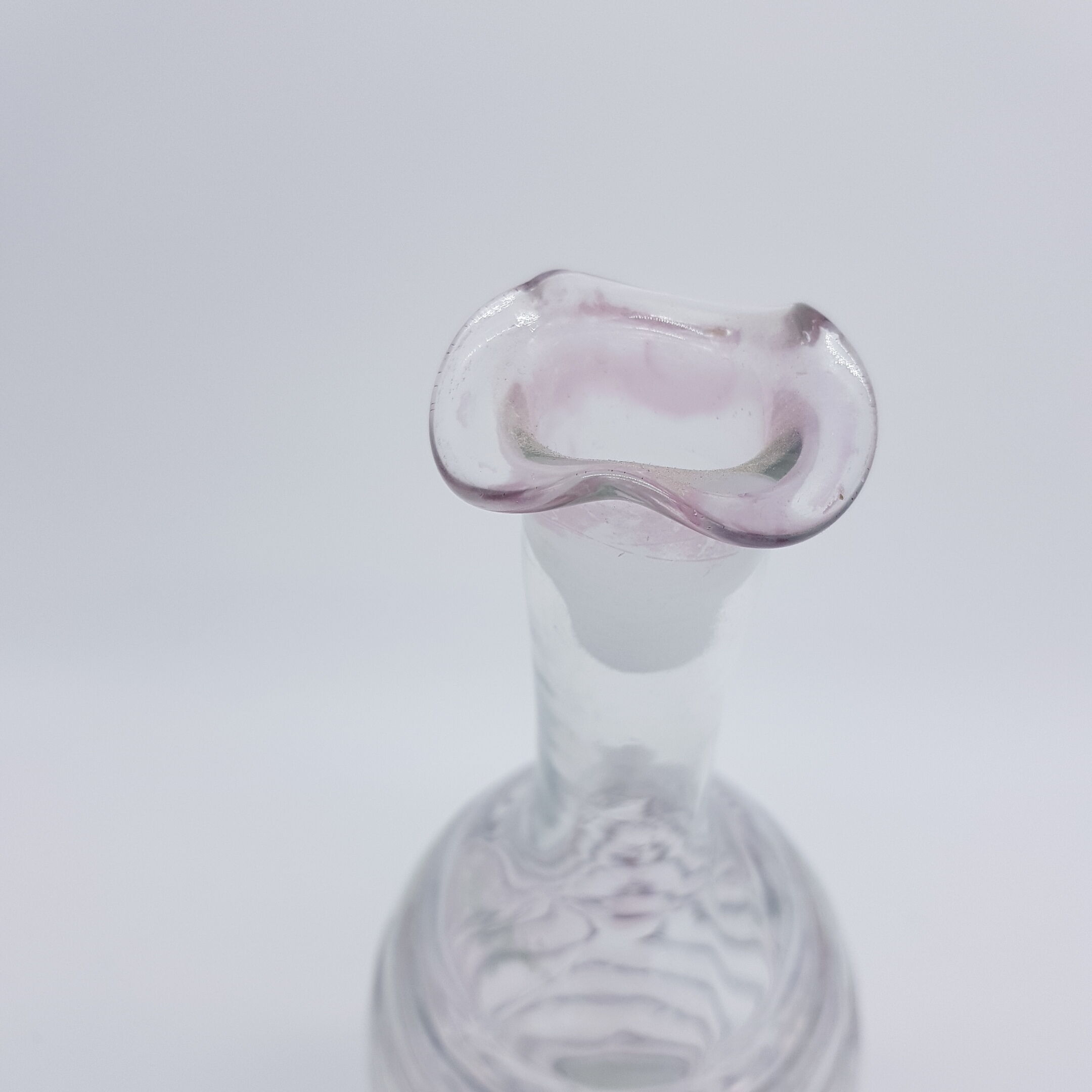 Old carafe ringed iridescent glass blown