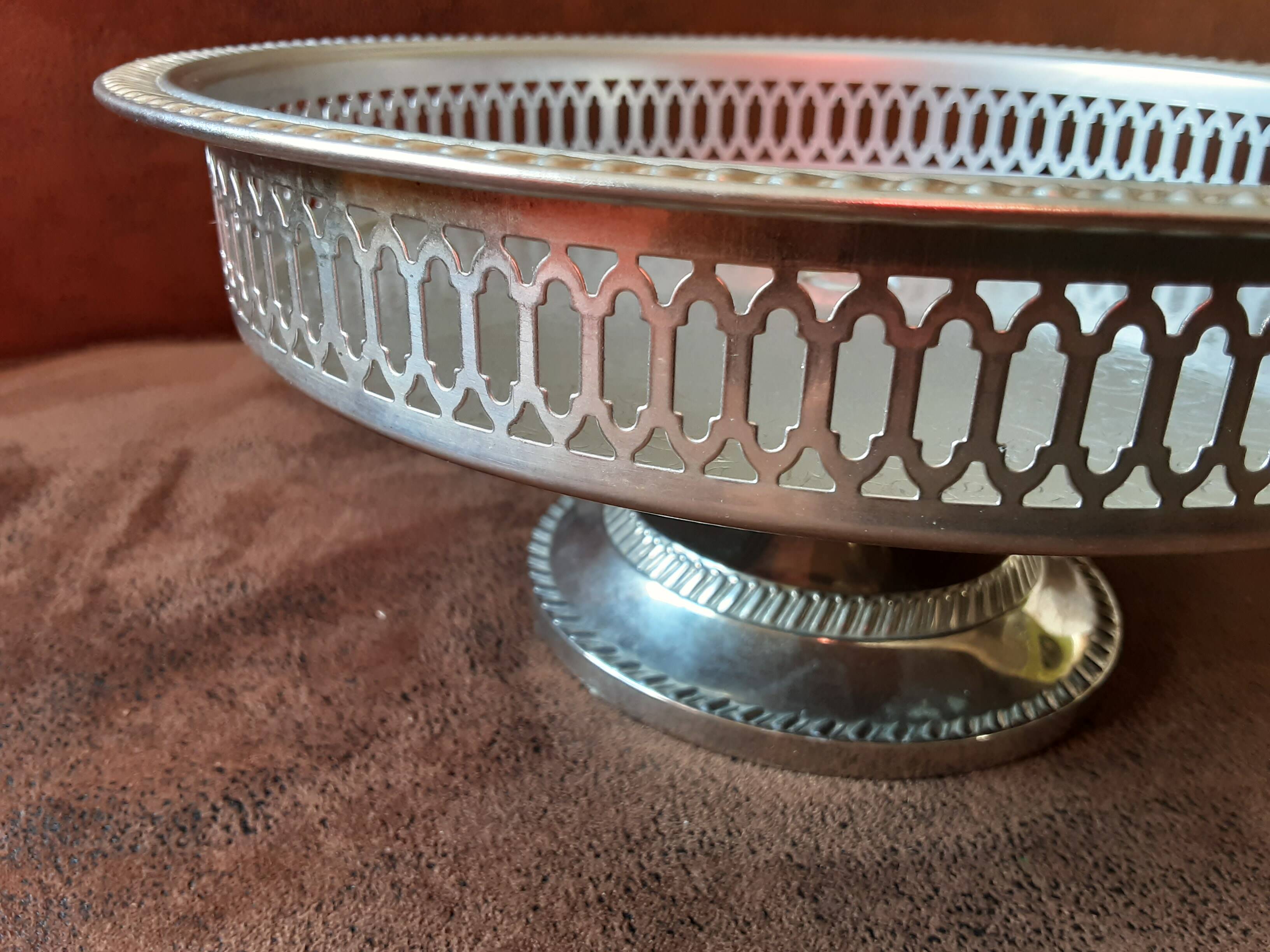 Old metal bowl on foot