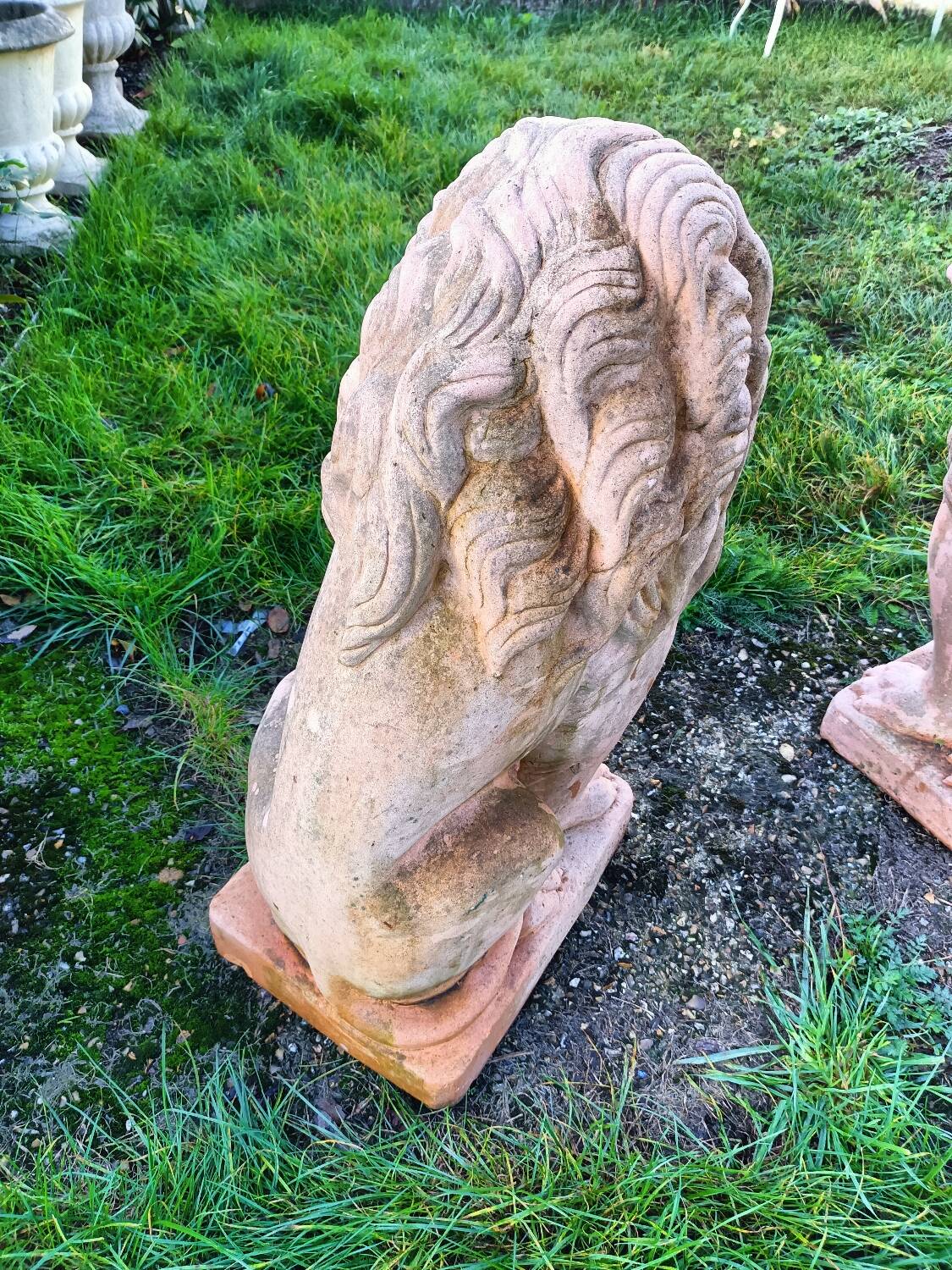 Pair of old terracotta garden lions