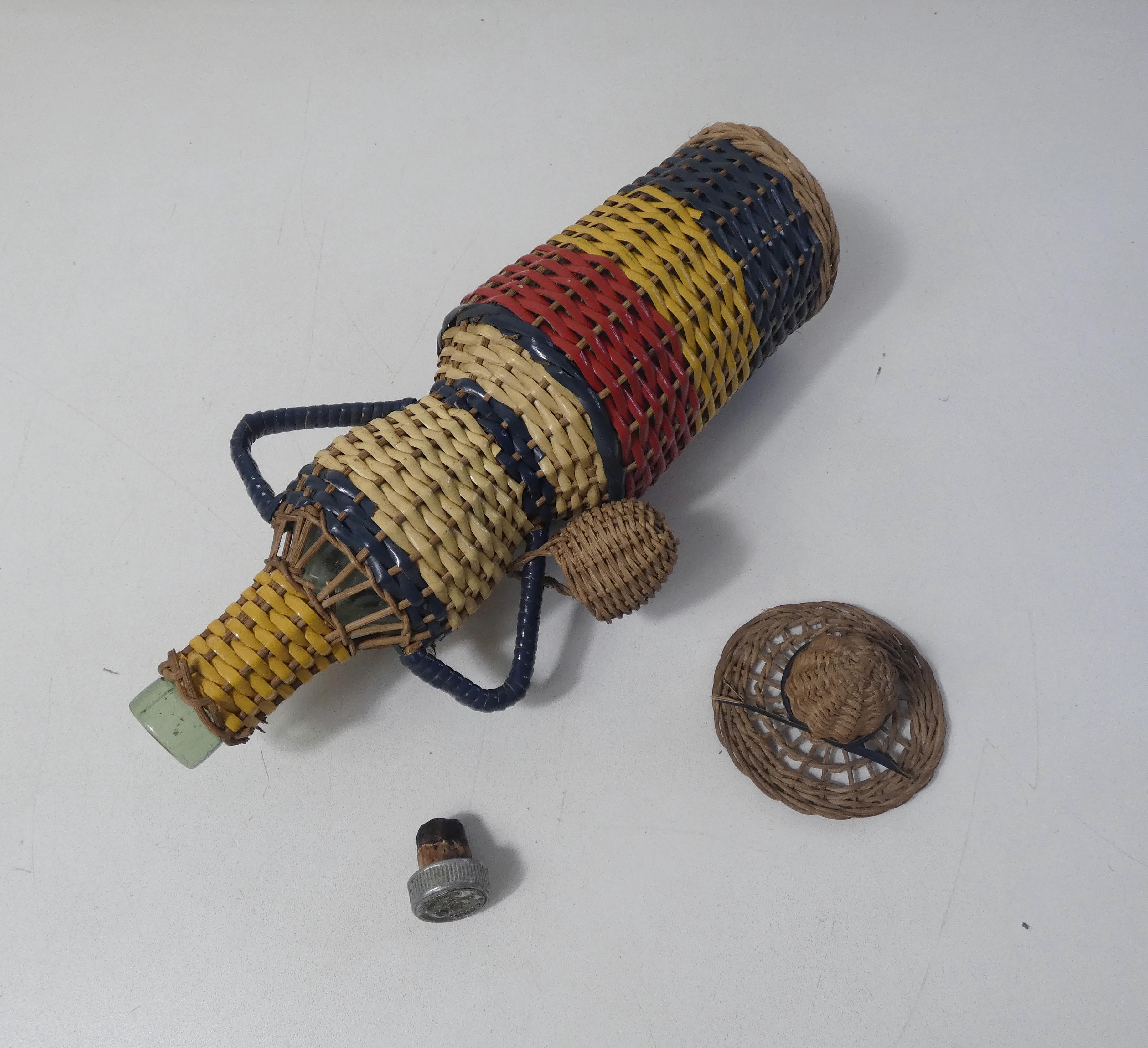 Old bottle dressed in scoubidou style rattan