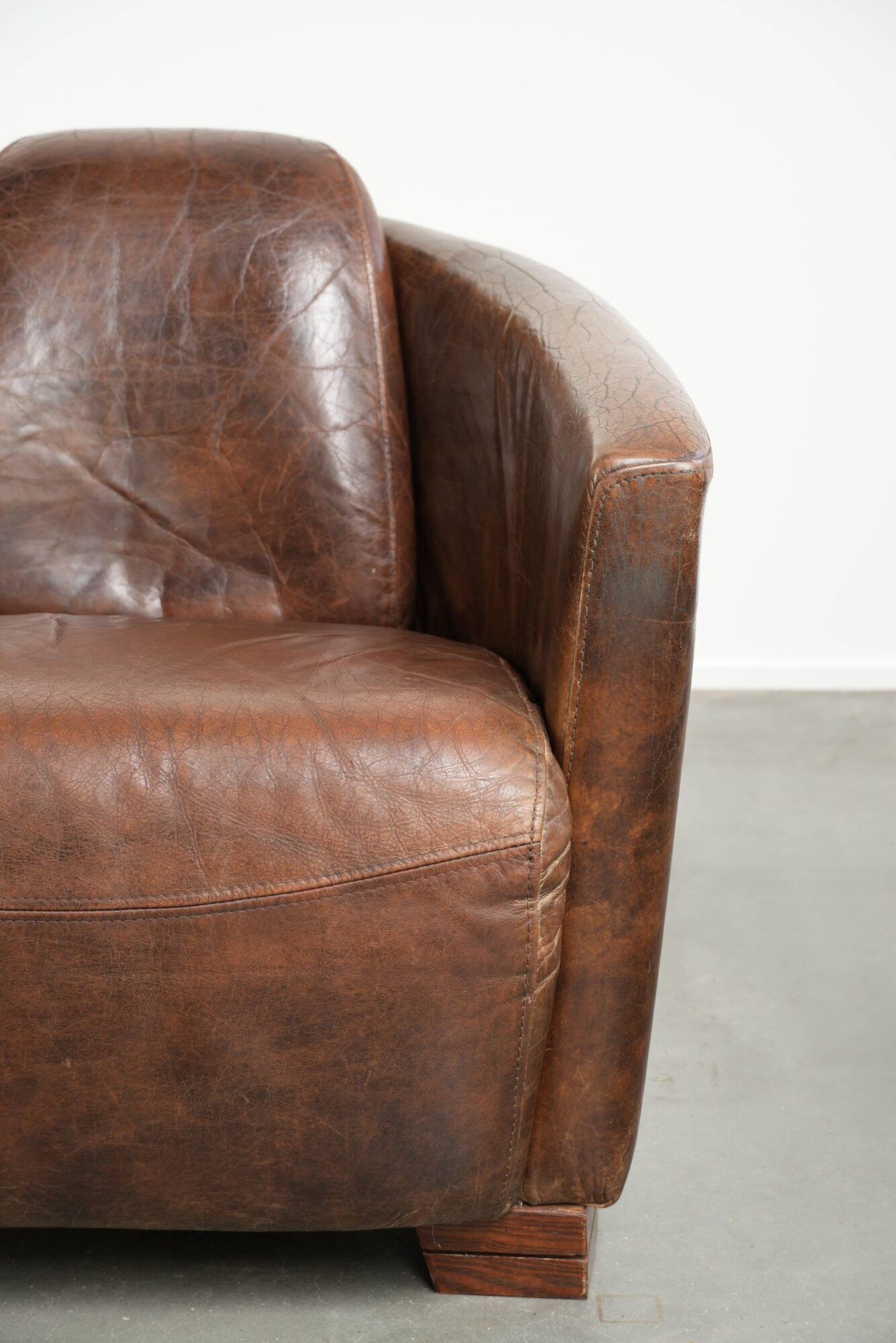 Cowhide armchair in Aviator design in a warm brown colour