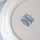 Old dish of opaque porcelain on ground transfer service