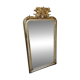 Antique mirror with a gilded frame and cherubs.