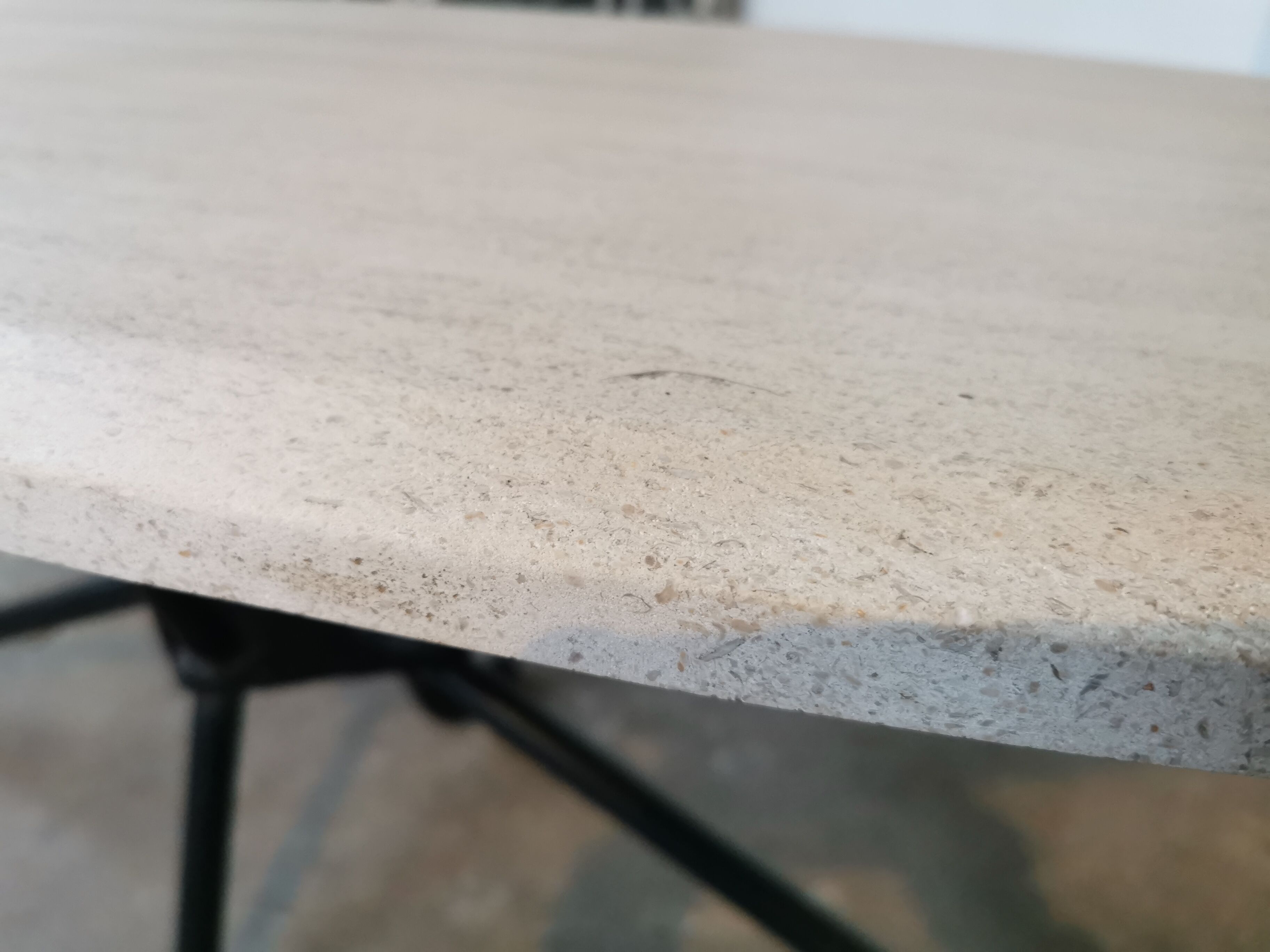 Large oval coffee table in travertine and metal