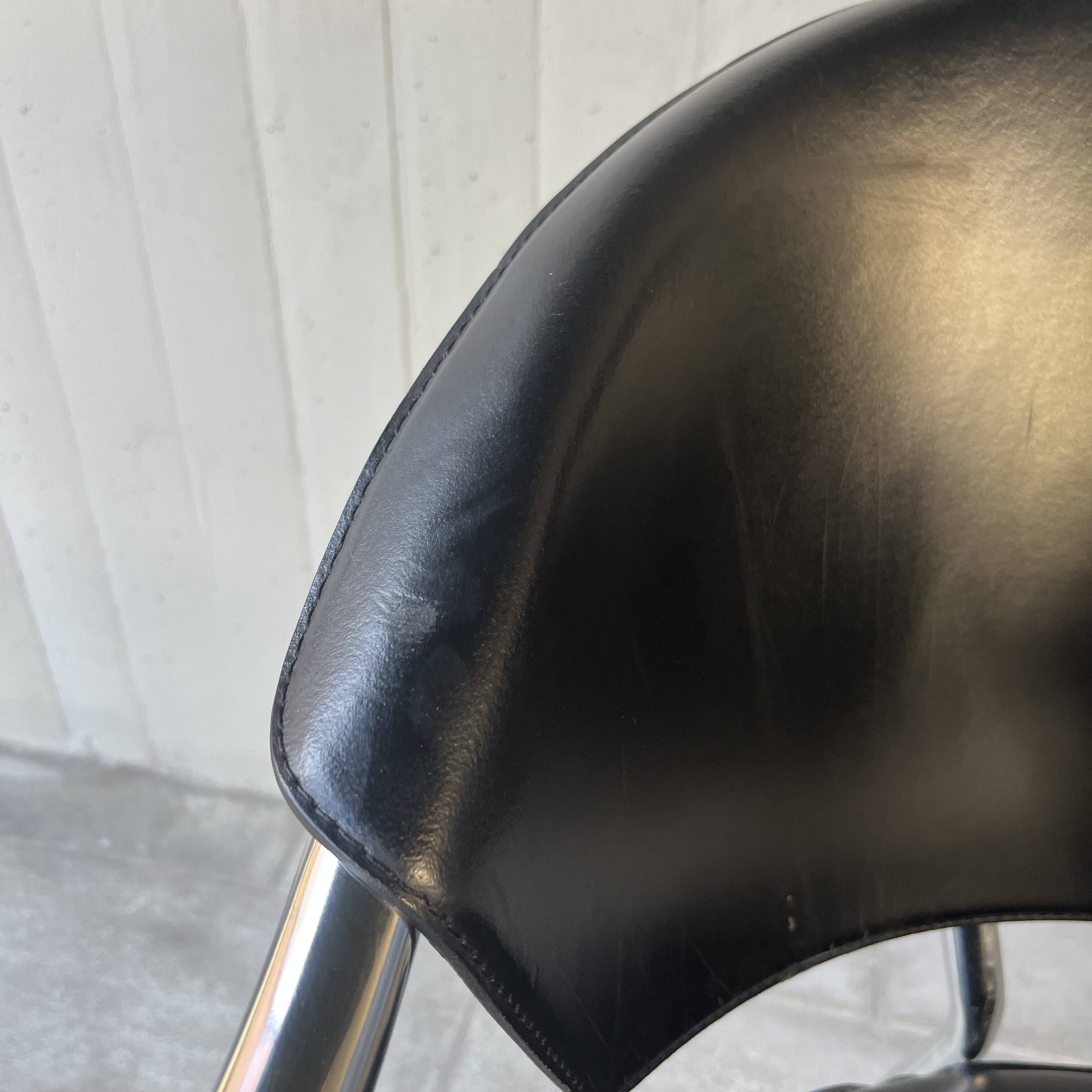 Set of four Italian black leather chairs, 1970