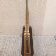 1960s brass folding magazine rack with lacquered wood decoration.