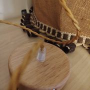 Large hanging pendant light with a burlap and pom-pom style