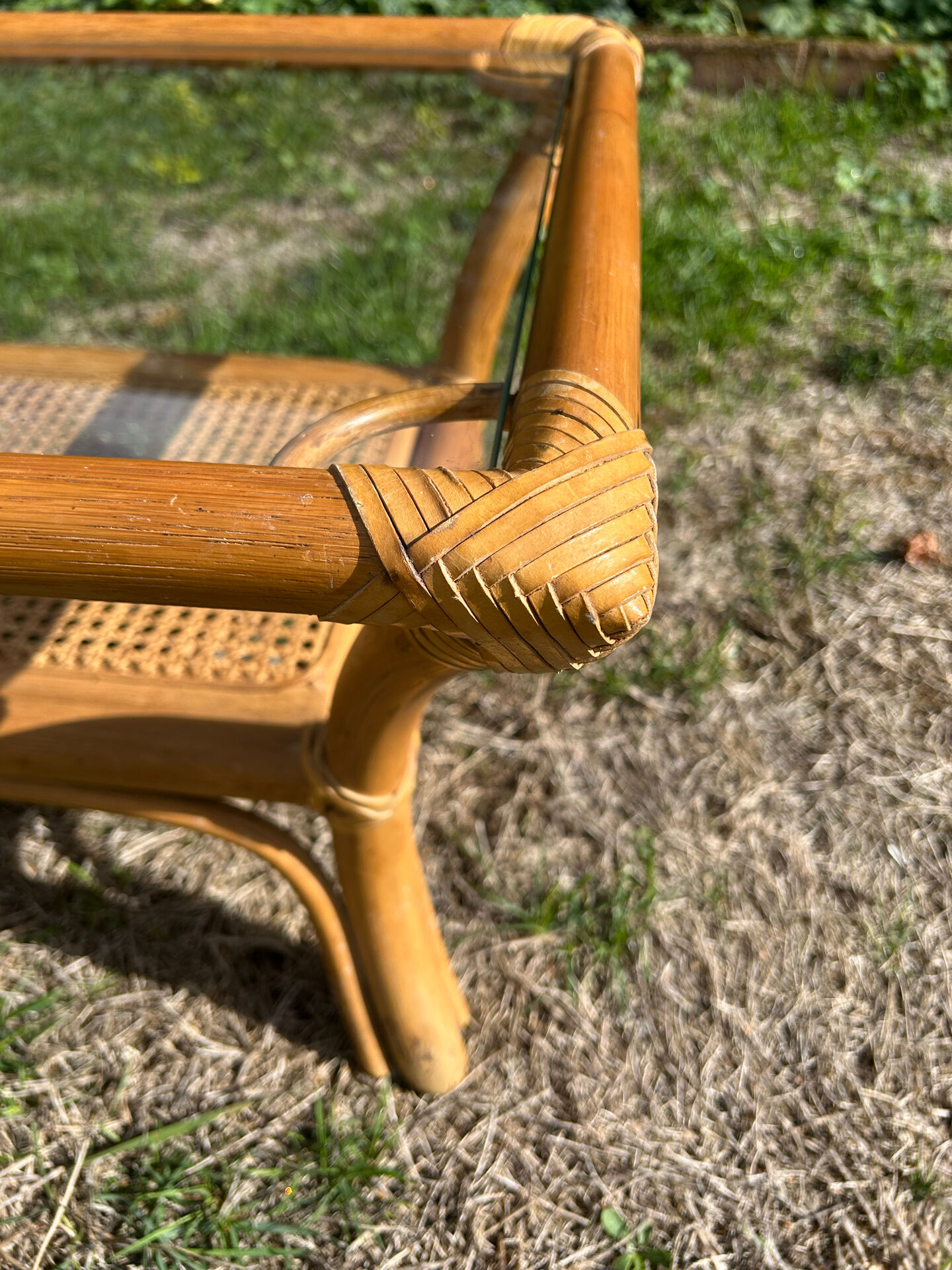 Light rattan coffee table with vintage 1970s caning.