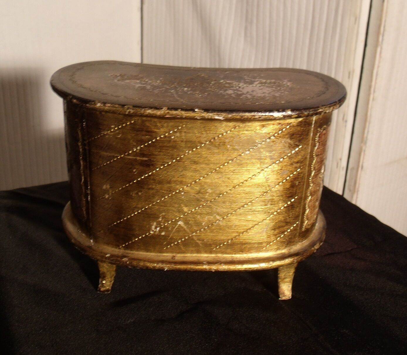 Jewelry box with gilded wooden drawers
