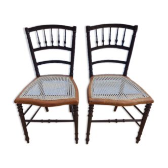 Two wooden canned chairs